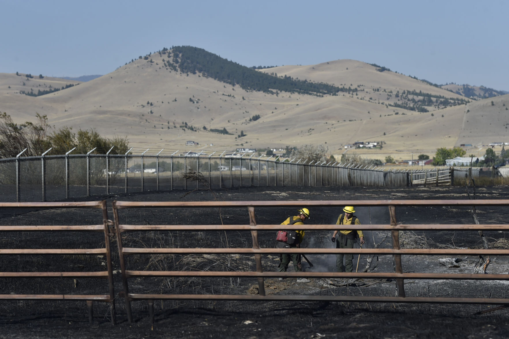 Firefighters mop up along Seven Mile Creek